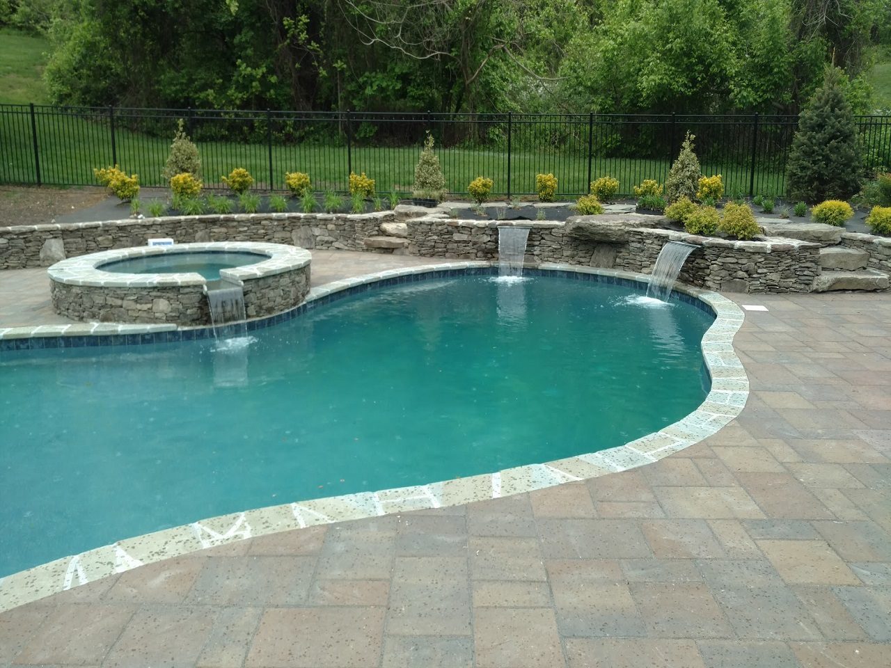Swimming pool with small falls.