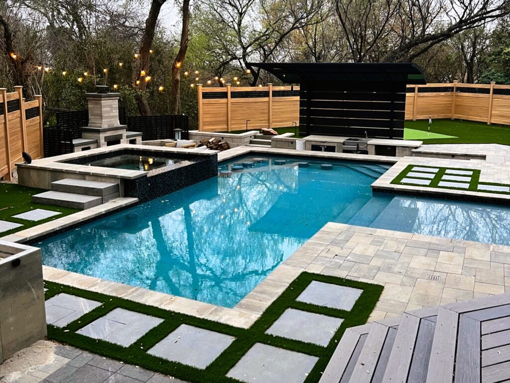 pool with spa and outdoor fireplace