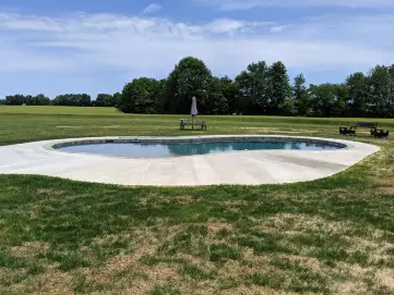 A custom free-form pool by Coastal Pools in Centreville, Maryland