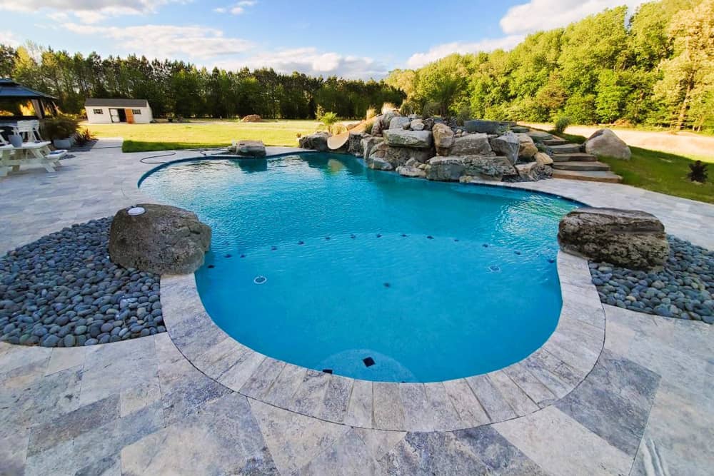 free form pool with slide and waterfall