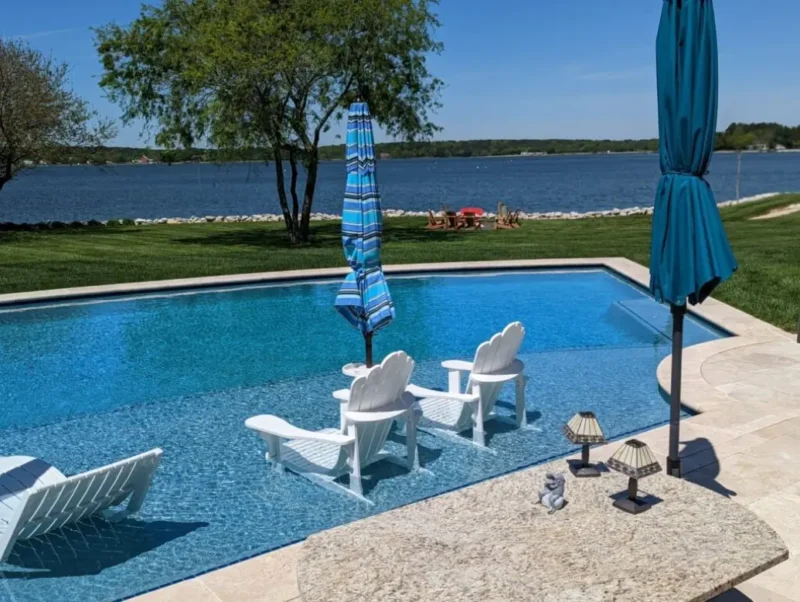 A custom sunken pool with a poolside bar by Coastal Pools in Maryland & Delaware