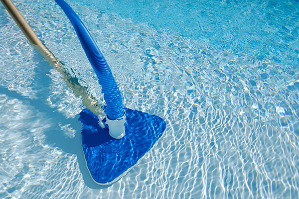 swimming pool vacuum cleaning a pool