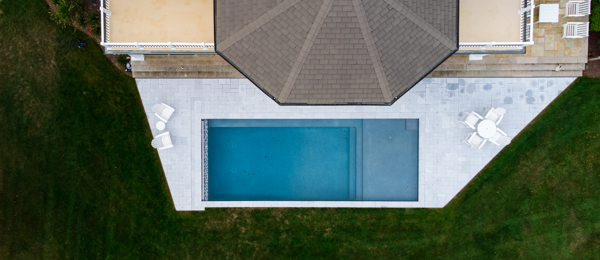 bird's eye aerial view of geometric pool with tanning ledge
