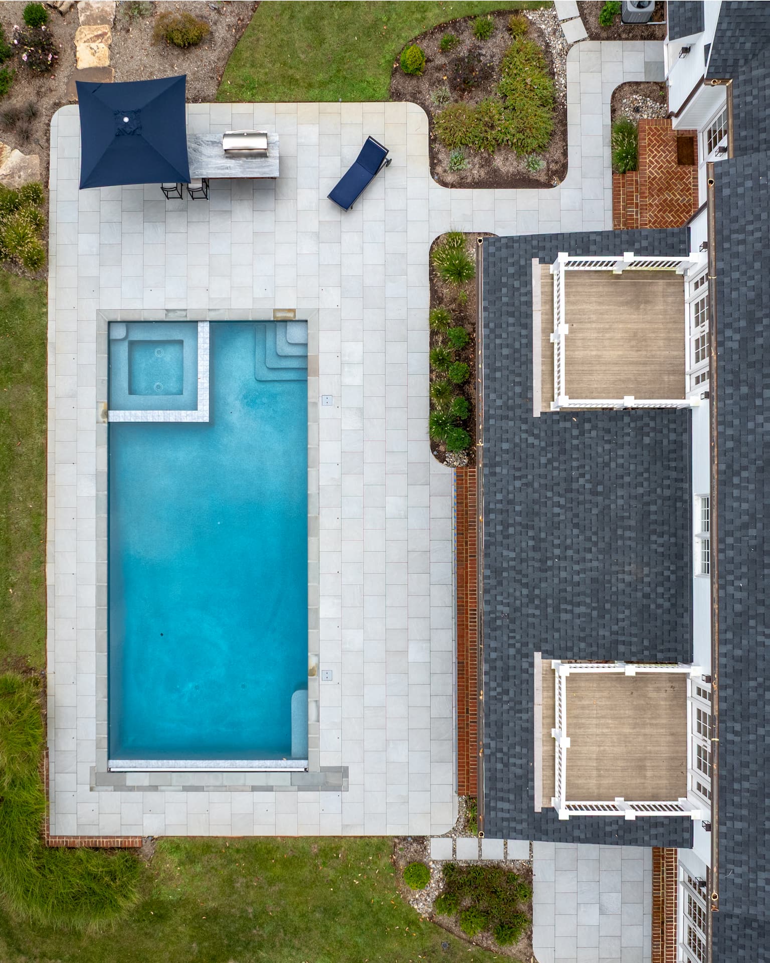 aerial view of pool, spa and outdoor kitchen
